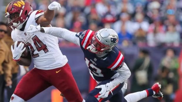 Jones (in blue) seen during New England's loss to Washington earlier this month